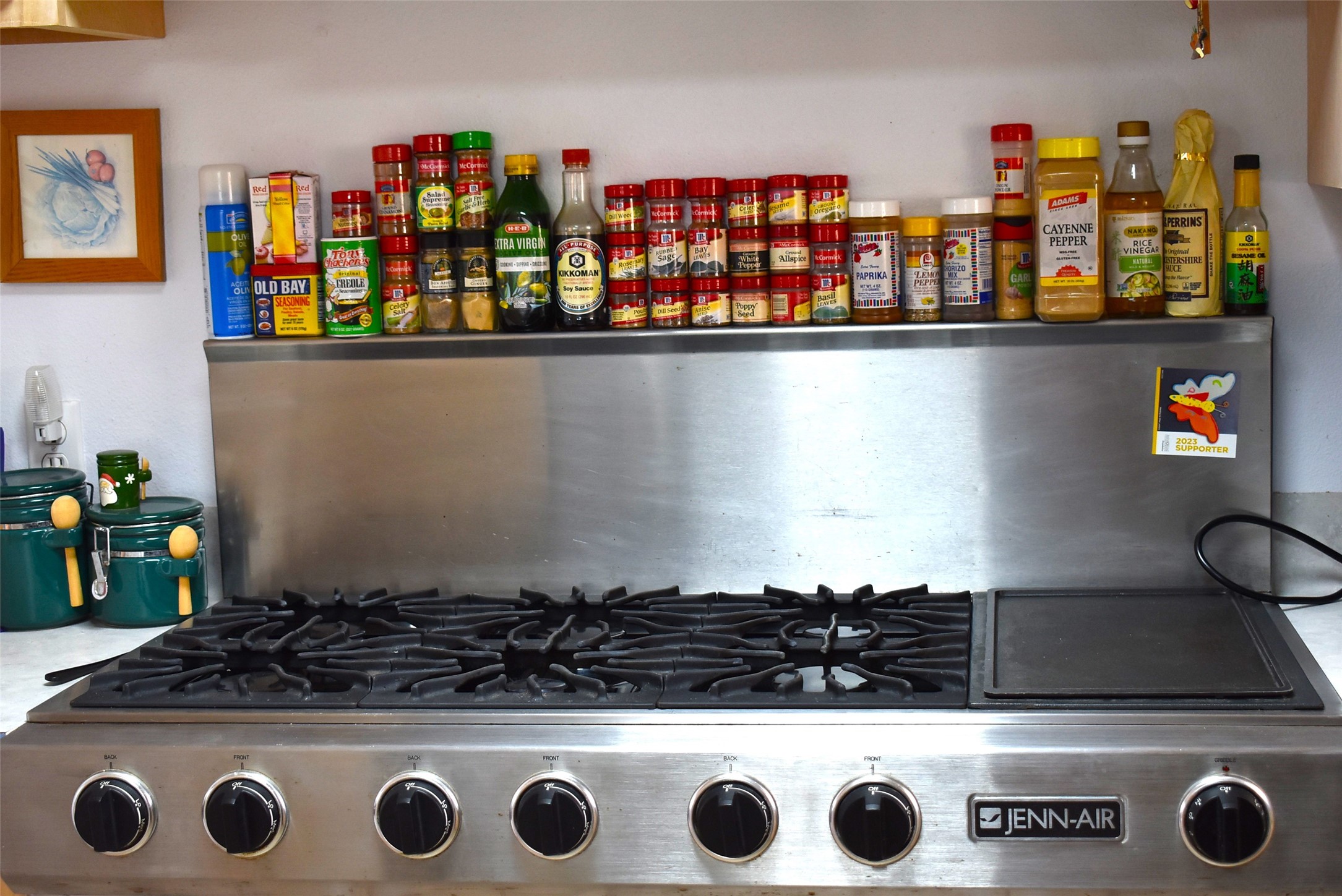 1657 County Road Sargent, TX 77414 - Photo 16 of 50 a kitchen with a stove and a shelf with wooden floor
