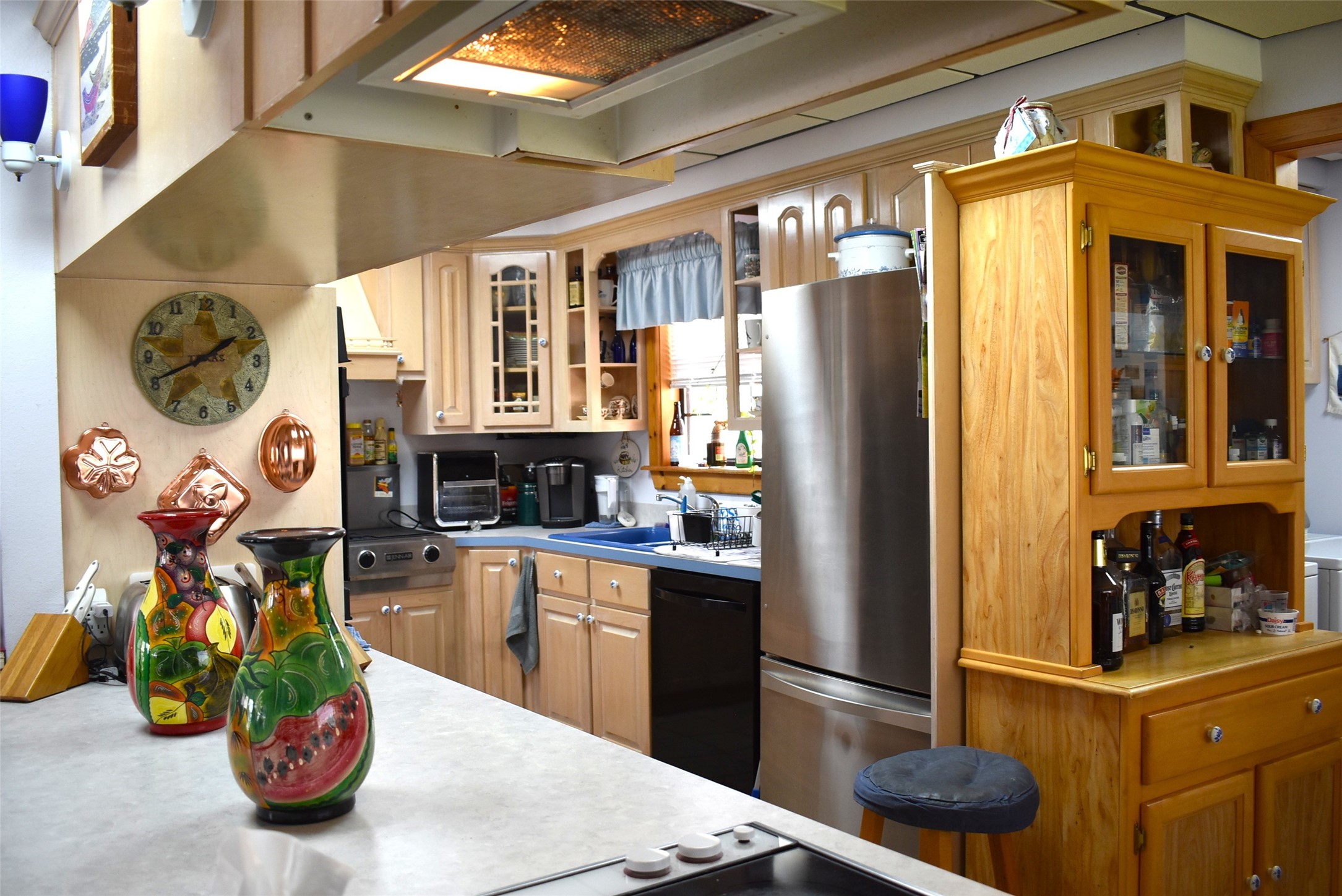 1657 County Road Sargent, TX 77414 - Photo 22 of 50 a kitchen with a refrigerator and a stove