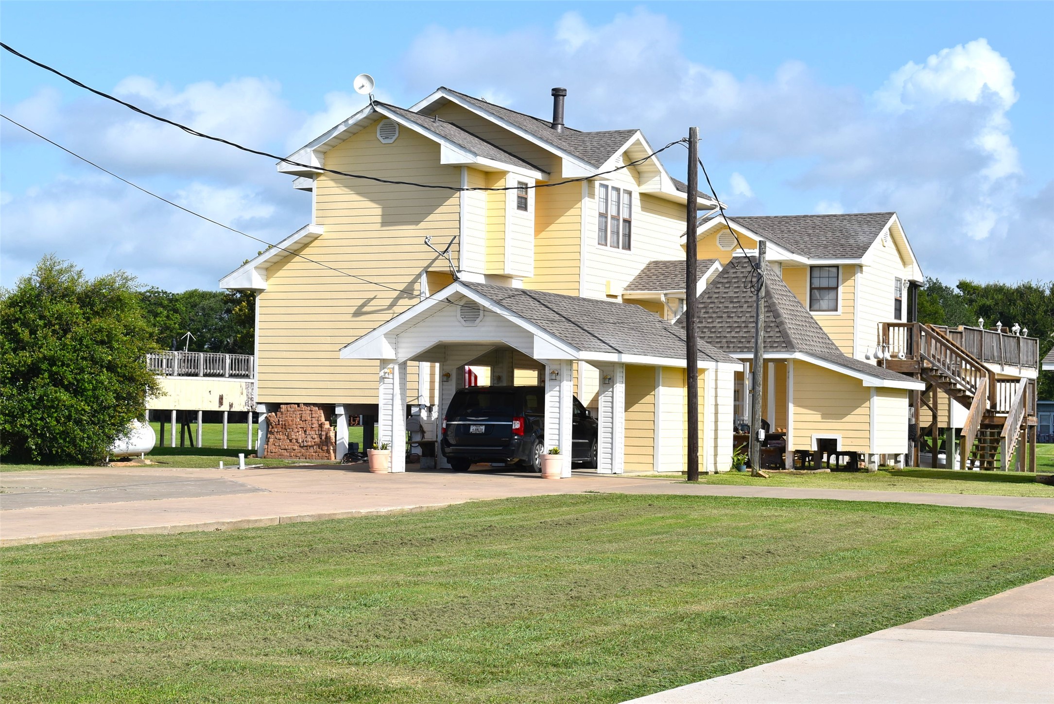 1657 County Road Sargent, TX 77414 - Photo 3 of 50 a front view of a house with a yard