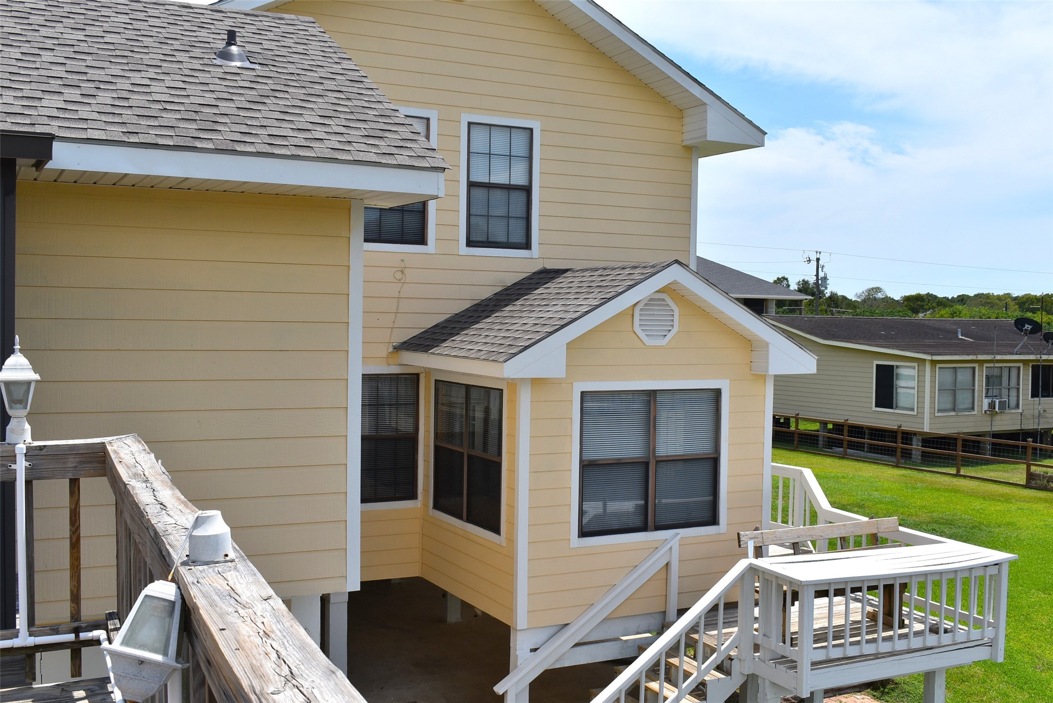 1657 County Road Sargent, TX 77414 - Photo 39 of 50 a view of a house with a large window and yard
