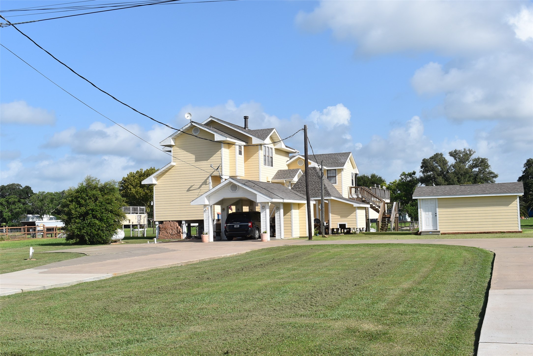 1657 County Road Sargent, TX 77414 - Photo 4 of 50 a front view of a house with a yard
