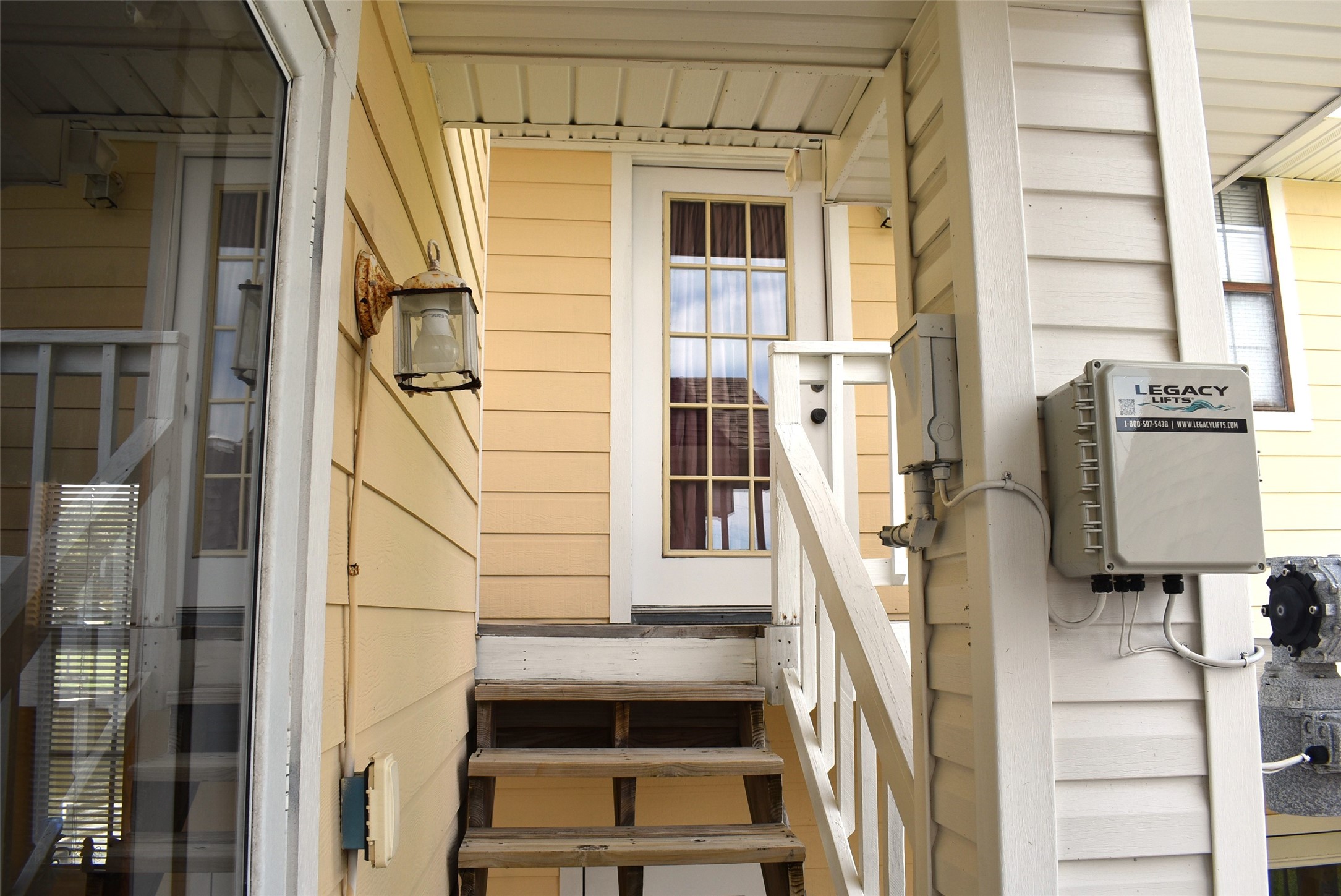 1657 County Road Sargent, TX 77414 - Photo 45 of 50 a front view of a house with large windows