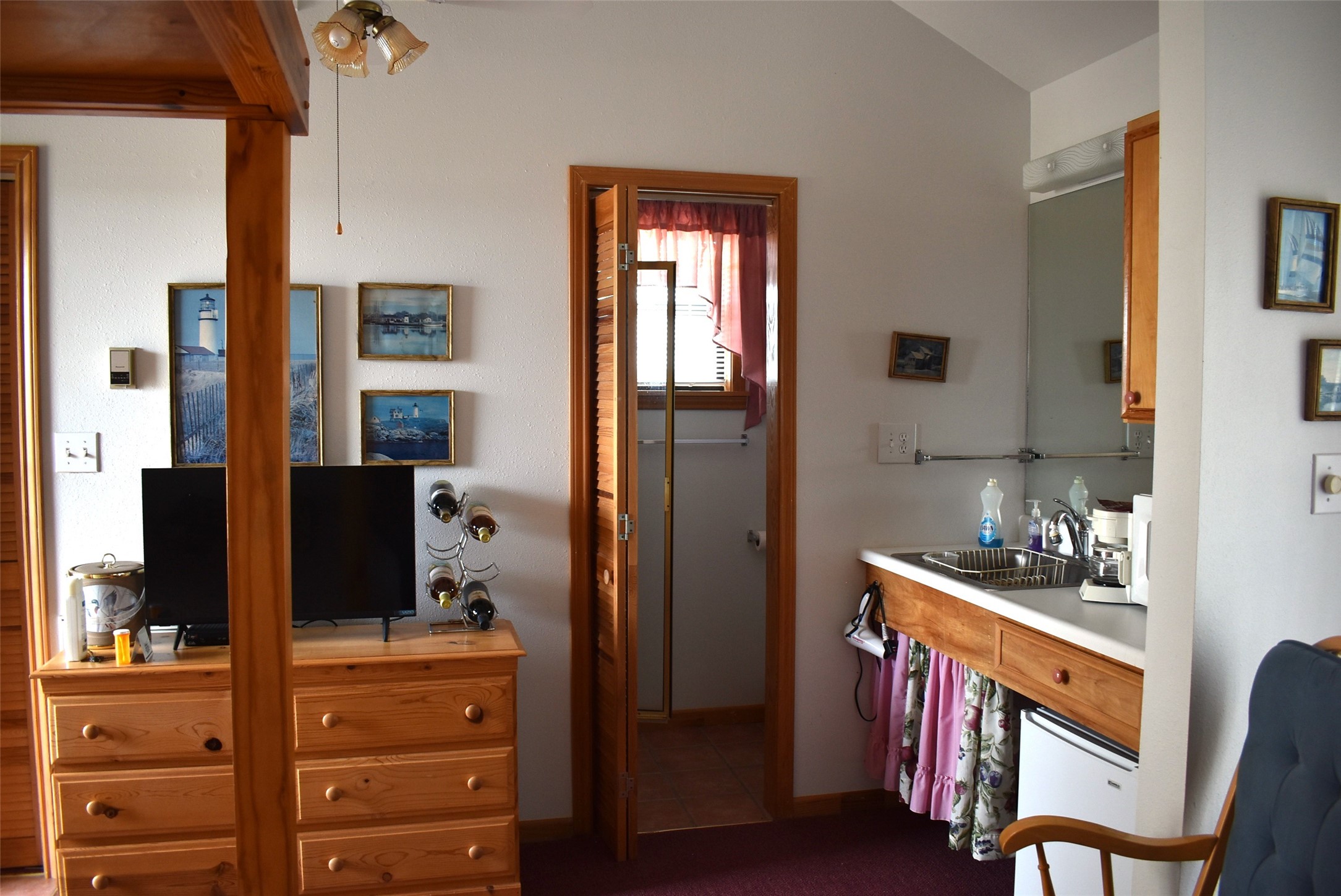 1657 County Road Sargent, TX 77414 - Photo 49 of 50 a room with furniture a flat screen tv and a table