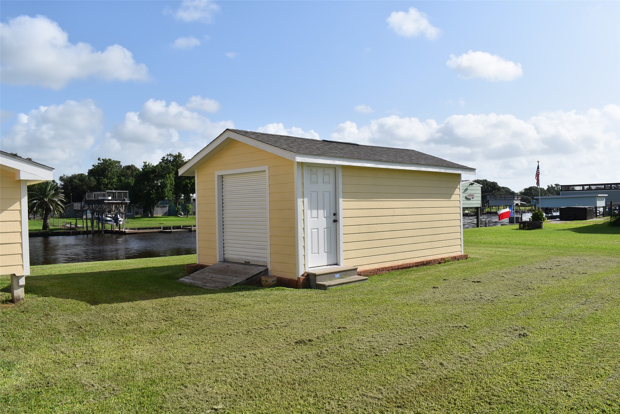 1657 County Road Sargent, TX 77414 - Photo 6 of 50 a front view of house with yard and car parked
