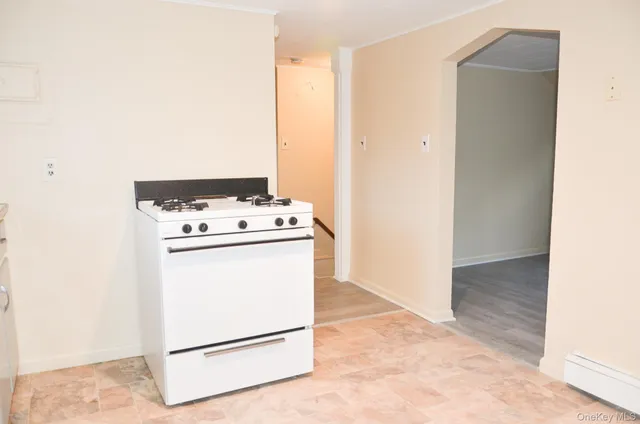 a sink with a window and cabinets