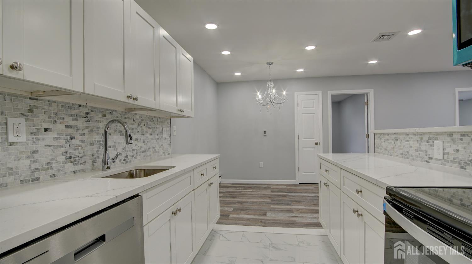 146 B Old Nassau Road Monroe Township, NJ 08831 - Photo 16 of 46 a kitchen with a sink and cabinets