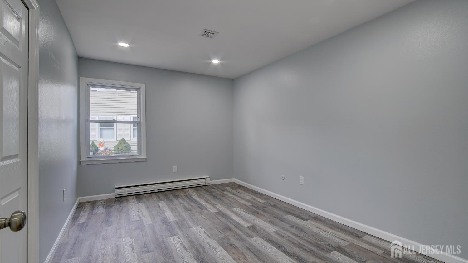 146 B Old Nassau Road Monroe Township, NJ 08831 - Photo 27 of 46 a view of empty room with wooden floor and fan
