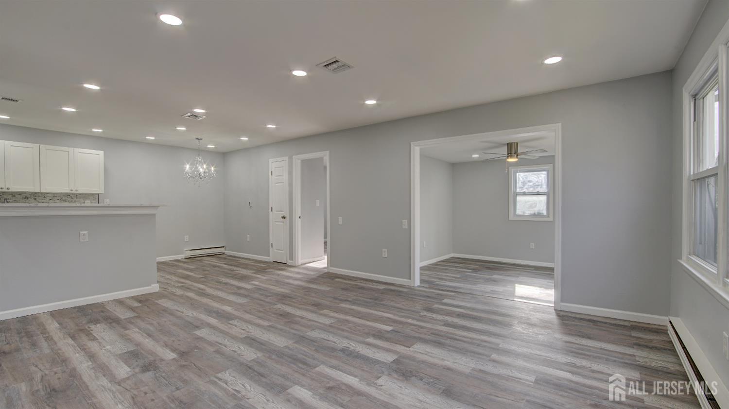 146 B Old Nassau Road Monroe Township, NJ 08831 - Photo 32 of 46 a view of an empty room with wooden floor and a window