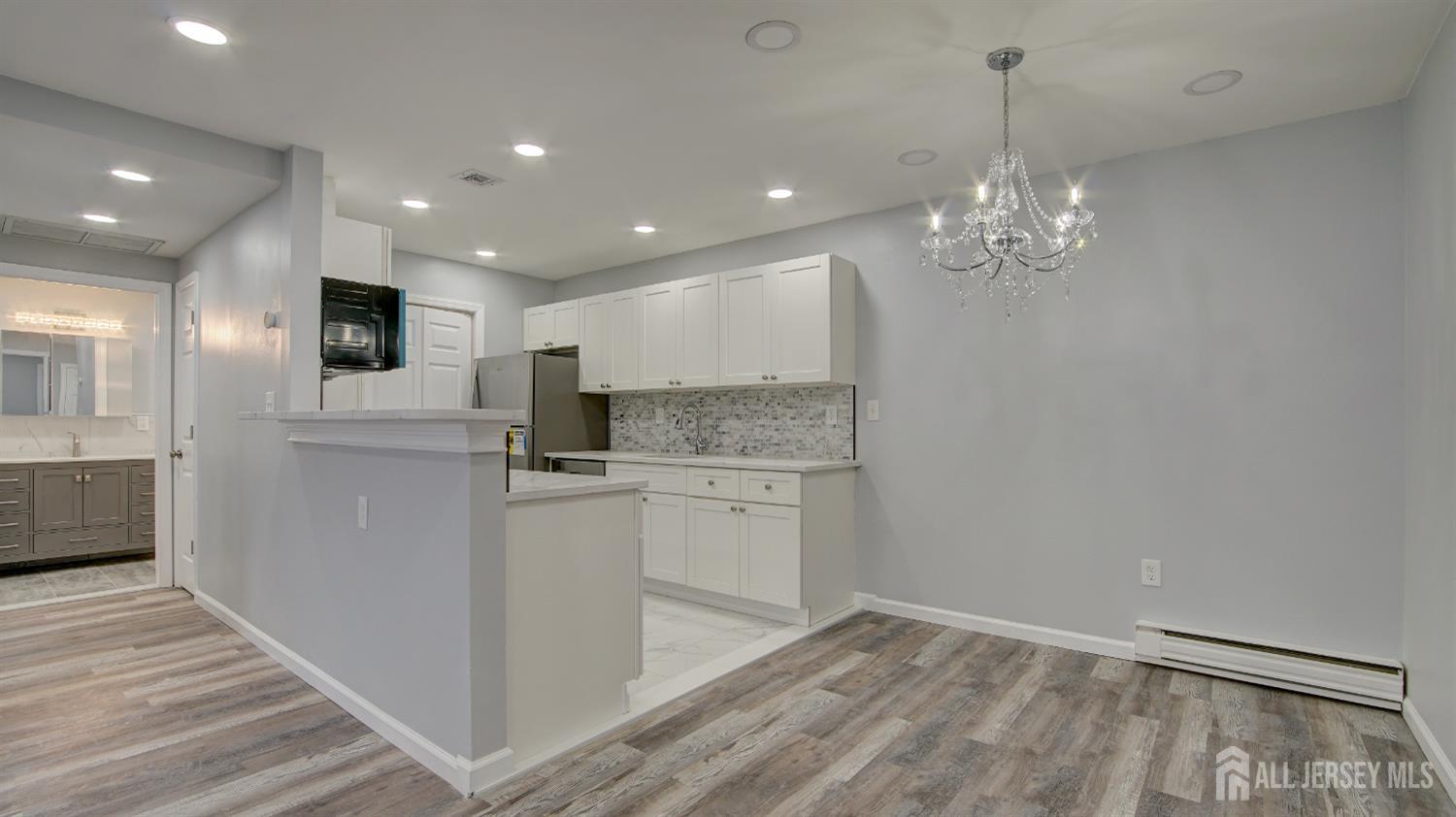 146 B Old Nassau Road Monroe Township, NJ 08831 - Photo 9 of 46 a kitchen with stainless steel appliances granite countertop a refrigerator and a stove top oven