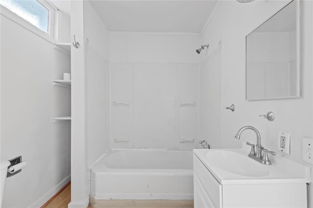 2012 Spring Street Pittsburgh, PA 15210 - Photo 12 of 20 a white bath tub sitting next to a white sink