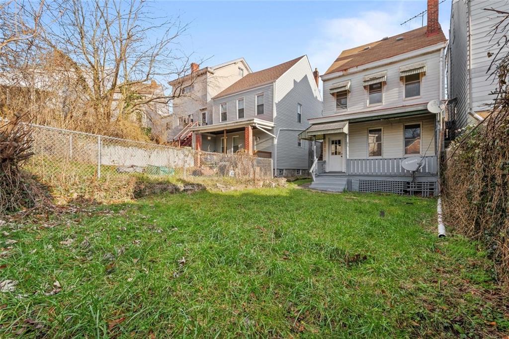 2012 Spring Street Pittsburgh, PA 15210 - Photo 3 of 20 a front view of a house with garden