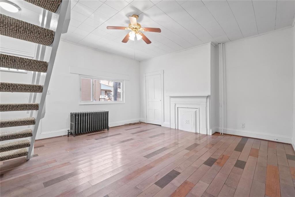 2012 Spring Street Pittsburgh, PA 15210 - Photo 7 of 20 a view of an empty room with a window and wooden floor