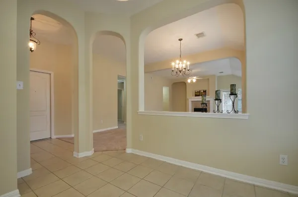 a view of a hallway with a chandelier