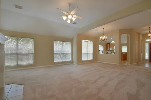a view of an empty room with a window
