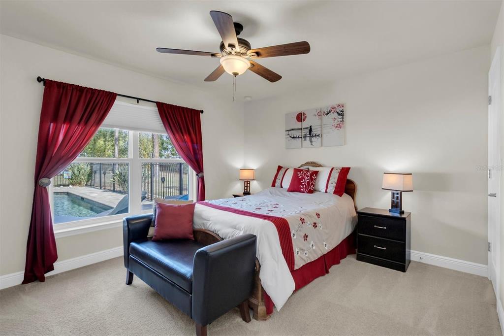 3455 Whispy Court Spring Hill, FL 34609 - Photo 14 of 42 a bedroom with a bed and a large window