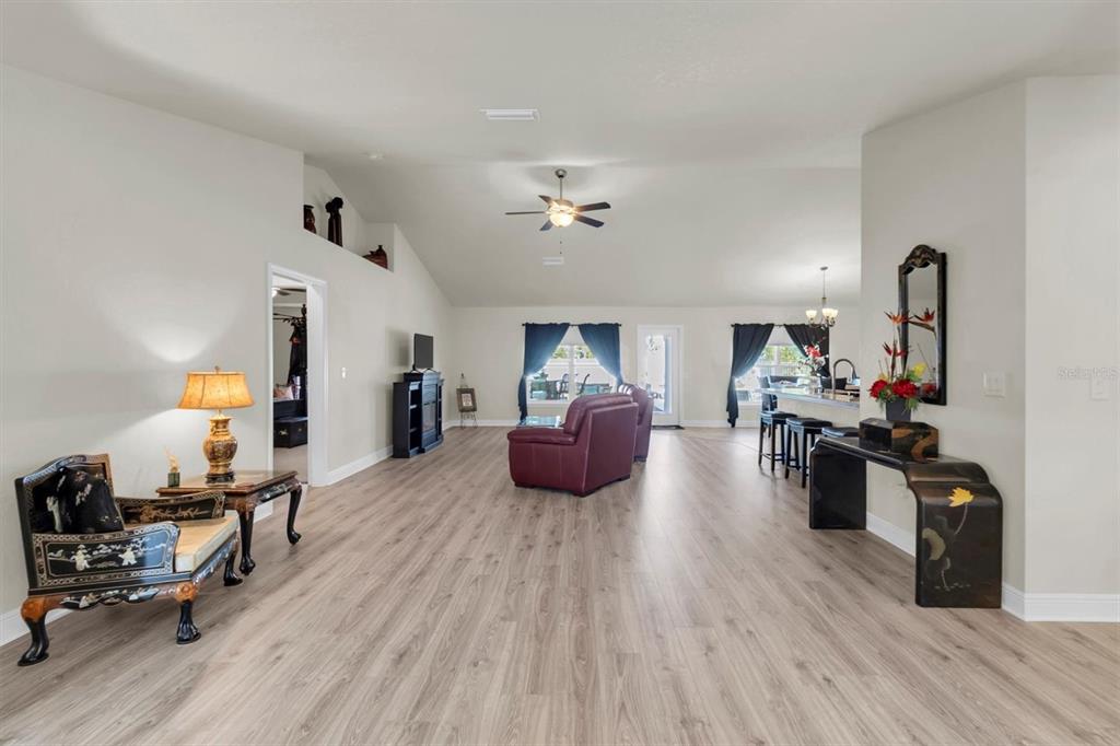 3455 Whispy Court Spring Hill, FL 34609 - Photo 16 of 42 a living room with furniture and a wooden floor