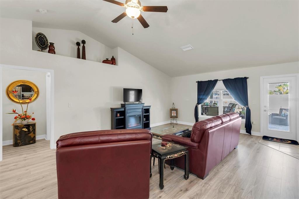 3455 Whispy Court Spring Hill, FL 34609 - Photo 18 of 42 a living room with furniture and a flat screen tv