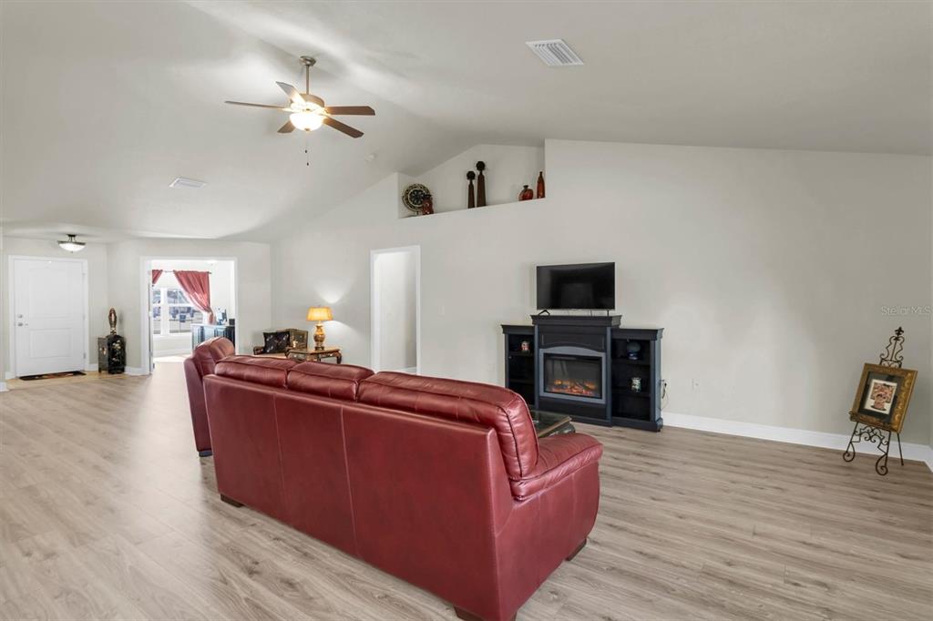 3455 Whispy Court Spring Hill, FL 34609 - Photo 19 of 42 a living room with furniture and a flat screen tv