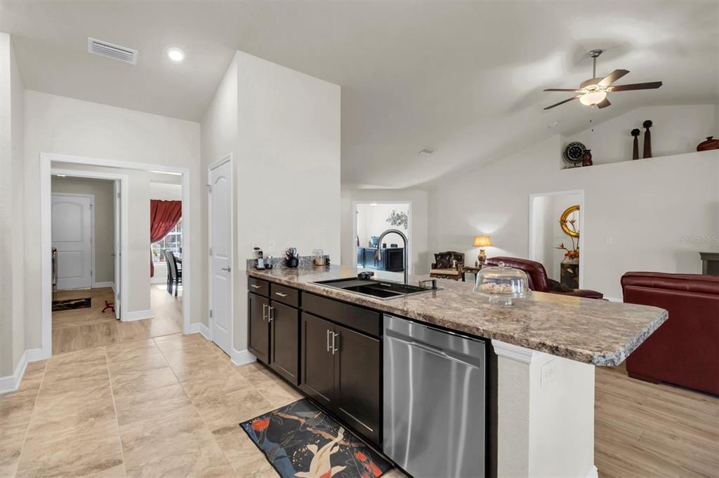 3455 Whispy Court Spring Hill, FL 34609 - Photo 21 of 42 a kitchen with a sink a counter space and appliances
