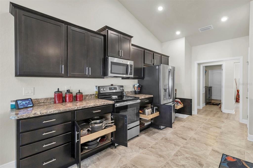 3455 Whispy Court Spring Hill, FL 34609 - Photo 23 of 42 a kitchen that has a lot of cabinets