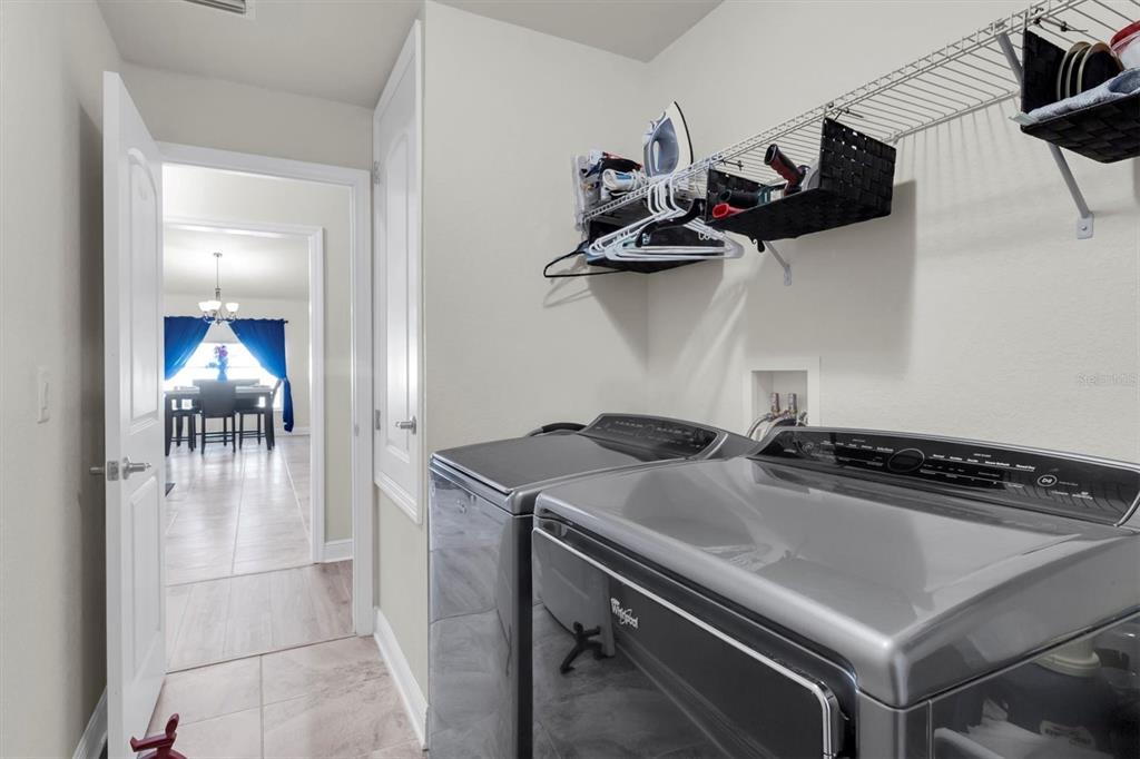 3455 Whispy Court Spring Hill, FL 34609 - Photo 25 of 42 a kitchen with a stove and cabinets