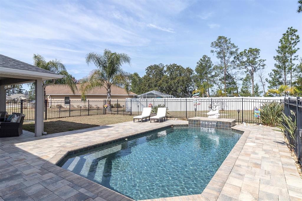 3455 Whispy Court Spring Hill, FL 34609 - Photo 28 of 42 a view of swimming pool with outdoor seating and plants