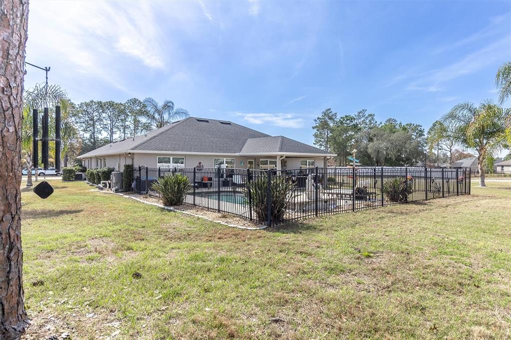 3455 Whispy Court Spring Hill, FL 34609 - Photo 35 of 42 a view of swimming pool with sitting area and furniture