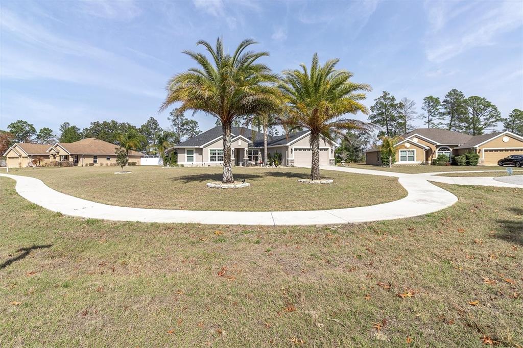 3455 Whispy Court Spring Hill, FL 34609 - Photo 40 of 42 a view of a swimming pool and a yard