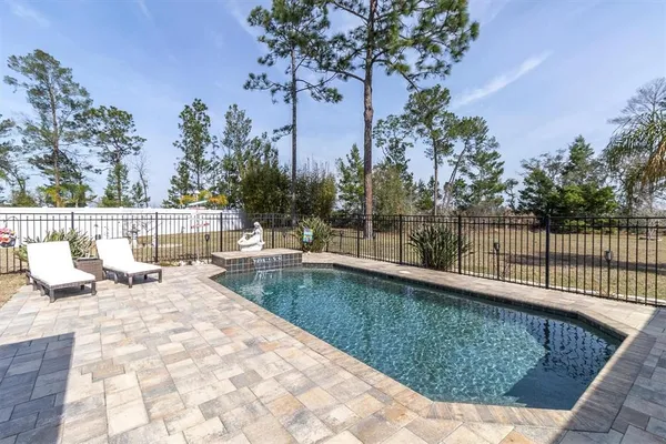 a view of a swimming pool with a patio