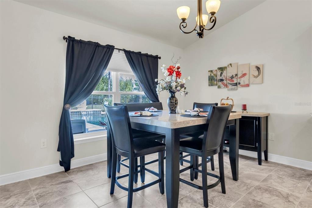3455 Whispy Court Spring Hill, FL 34609 - Photo 8 of 42 a view of a dining room with furniture window and outside view