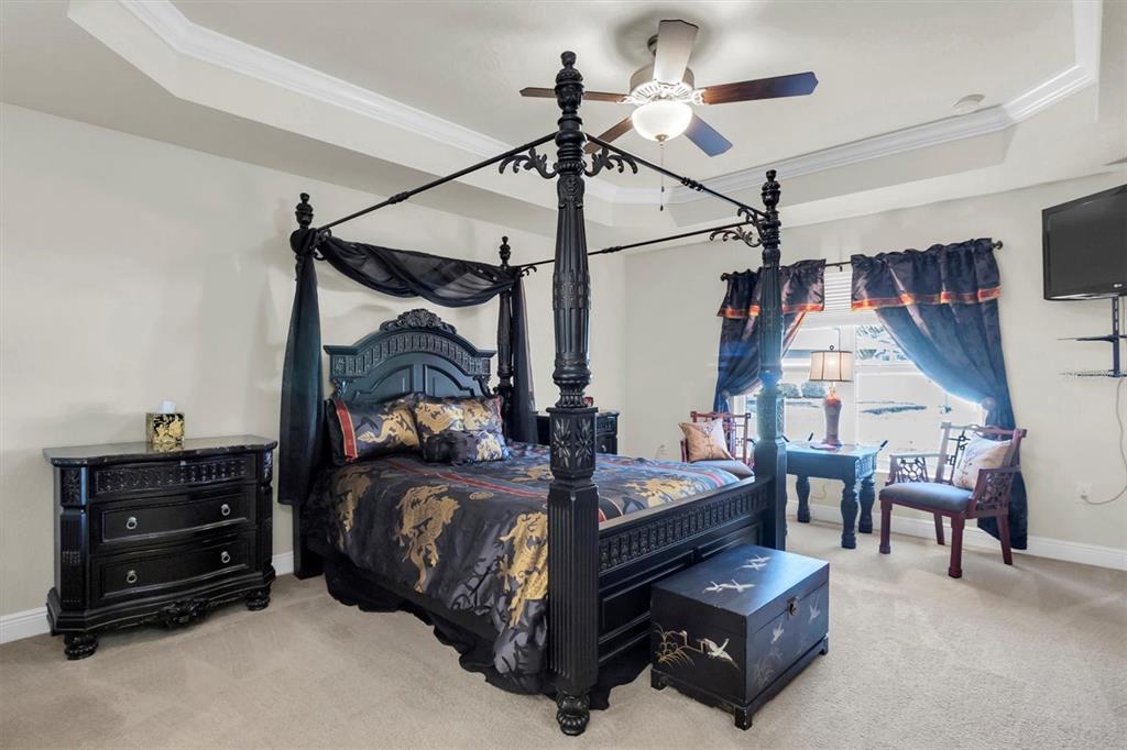 3455 Whispy Court Spring Hill, FL 34609 - Photo 10 of 42 a bedroom with a bed window and a lamp