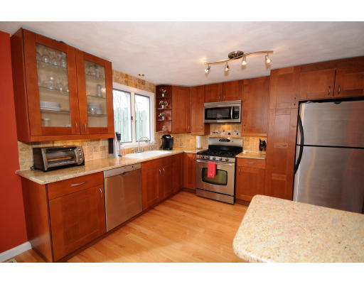 8 Apple Ridge Road, Unit 2 Maynard, MA 01754 - Photo 1 of 1 a kitchen with granite countertop a refrigerator stove top oven and sink