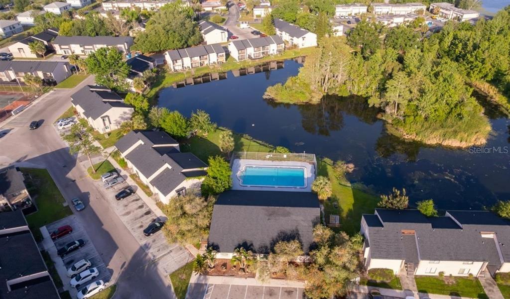 4033 Henley Road, Unit 1707 Orlando, FL 32839 - Photo 64 of 66 an aerial view of a house with a yard and garden