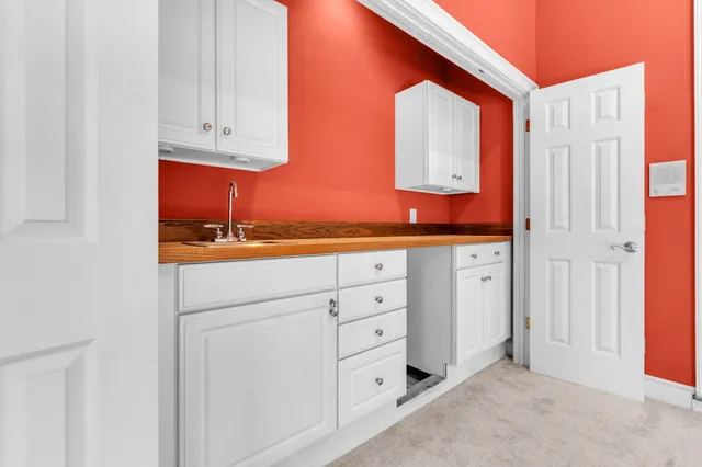 a view of cabinets and wooden floor