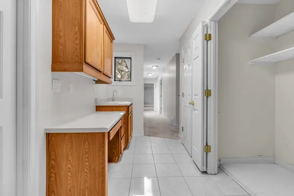 a kitchen with a sink and a refrigerator
