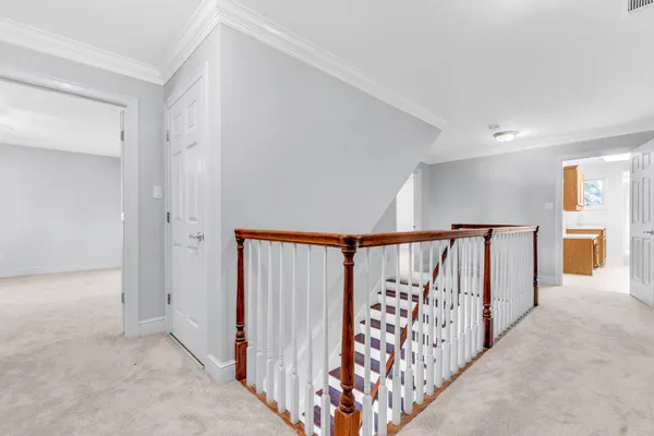 a view of a hallway with staircase