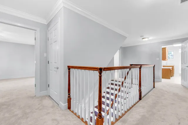 a view of a hallway with staircase