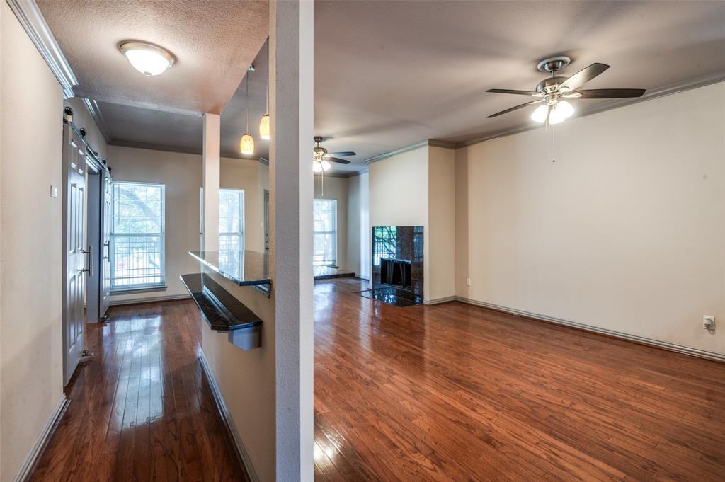 2524 Preston Road, Unit 1404 Plano, TX 75093 - Photo 6 of 15 wooden floor in an empty room with a window