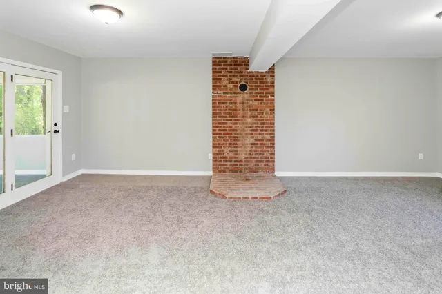 a view of an empty room with windows