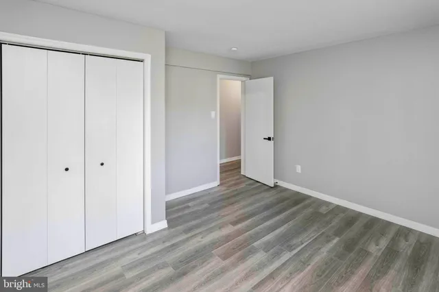 a bathroom with a sink toilet and a mirror