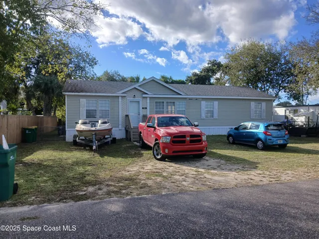 a car parked in front of a house