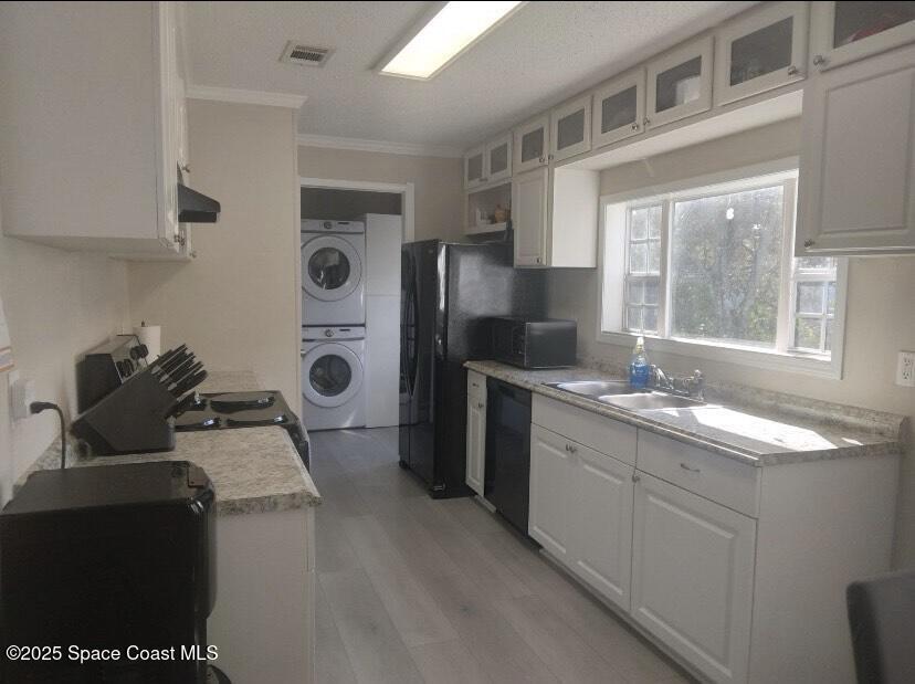 7013 Fern Drive Cocoa, FL 32927 - Photo 3 of 4 a kitchen with a sink stove and refrigerator