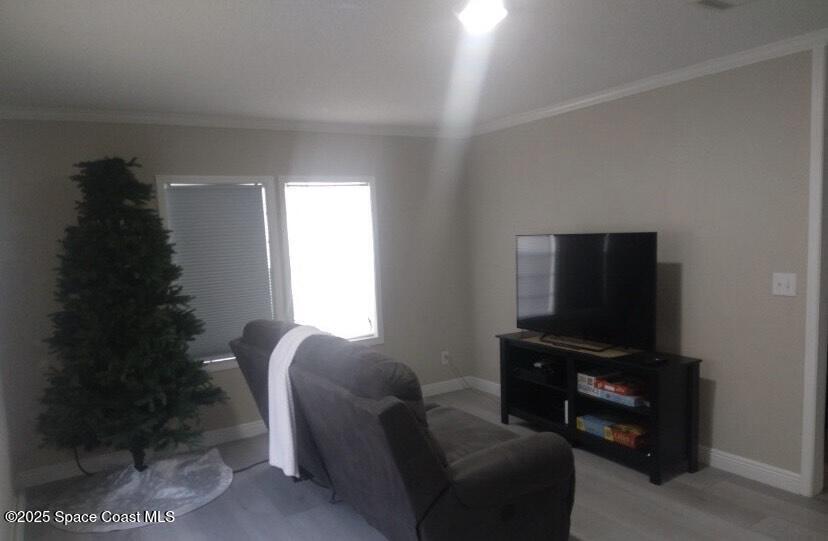 7013 Fern Drive Cocoa, FL 32927 - Photo 4 of 4 a living room with furniture and a flat screen tv