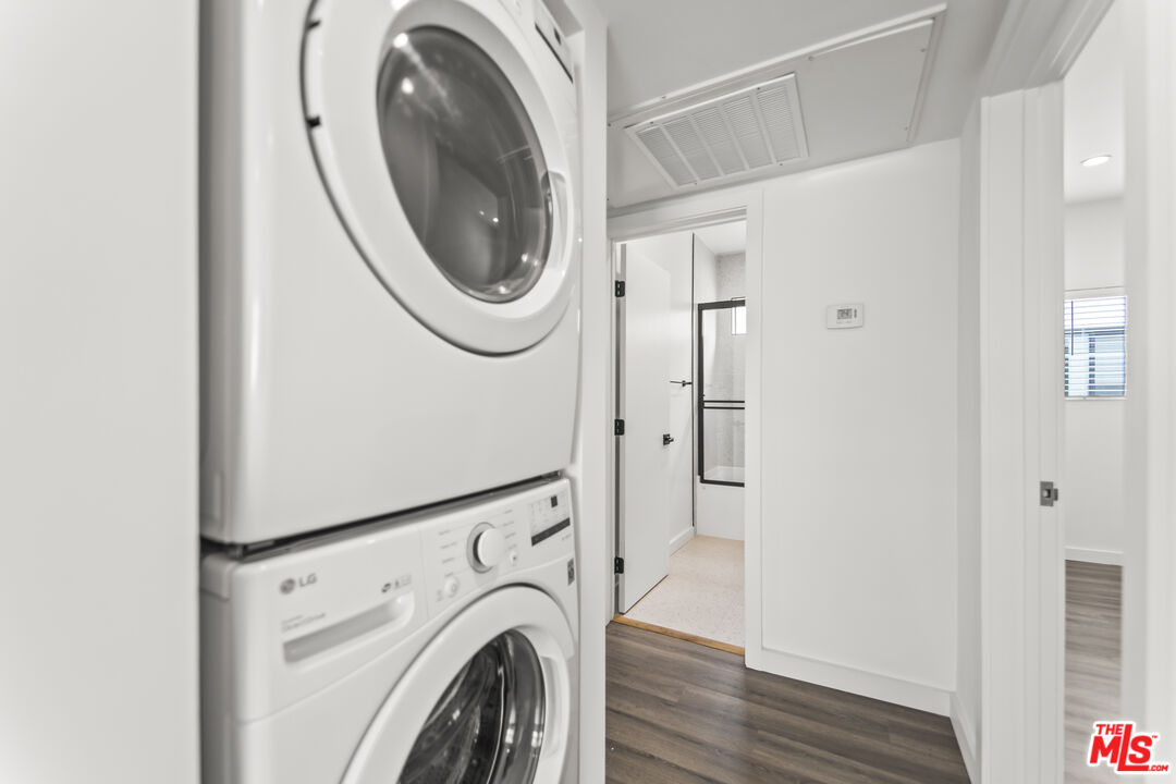 1264 9th Street, Unit J Santa Monica, CA 90401 - Photo 11 of 23 a utility room with dryer and washer