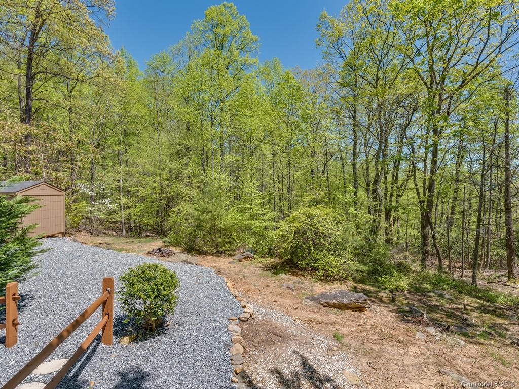 1251 Judes Gap Road Mill Spring, NC 28756 - Photo 23 of 35 a view of a pathway both side of yard