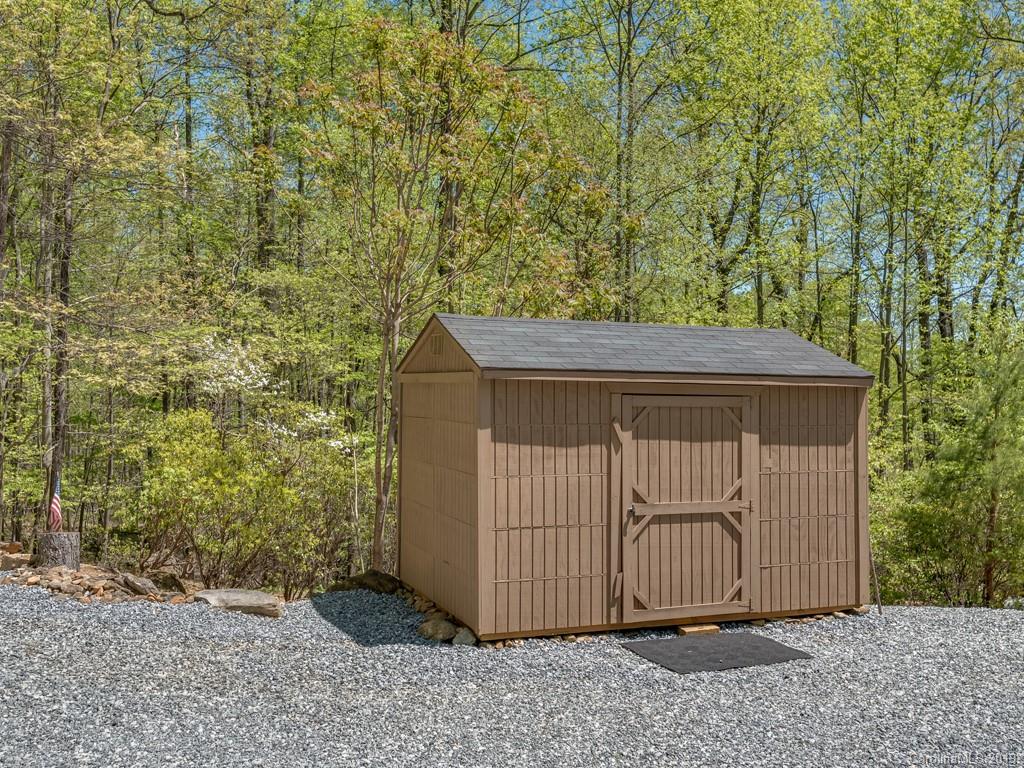 1251 Judes Gap Road Mill Spring, NC 28756 - Photo 25 of 35 a backyard of a house