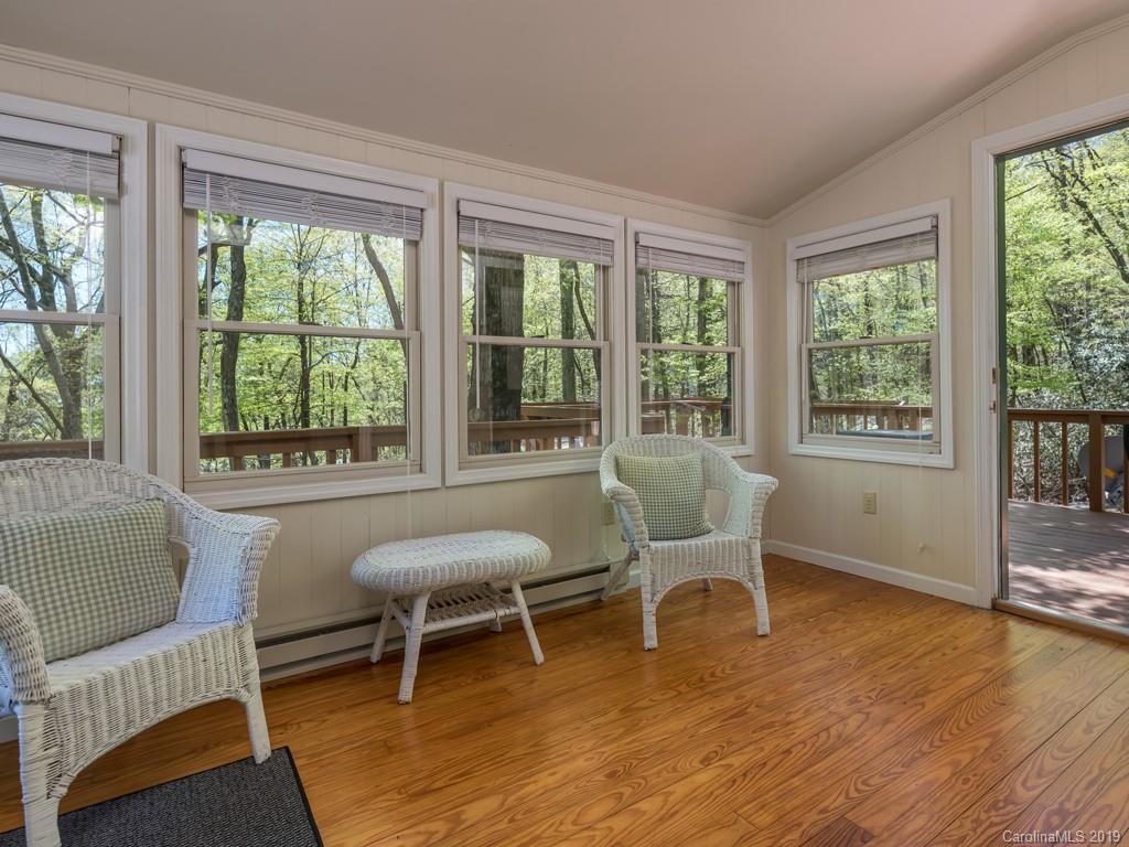 1251 Judes Gap Road Mill Spring, NC 28756 - Photo 9 of 35 a living room with furniture and a large window