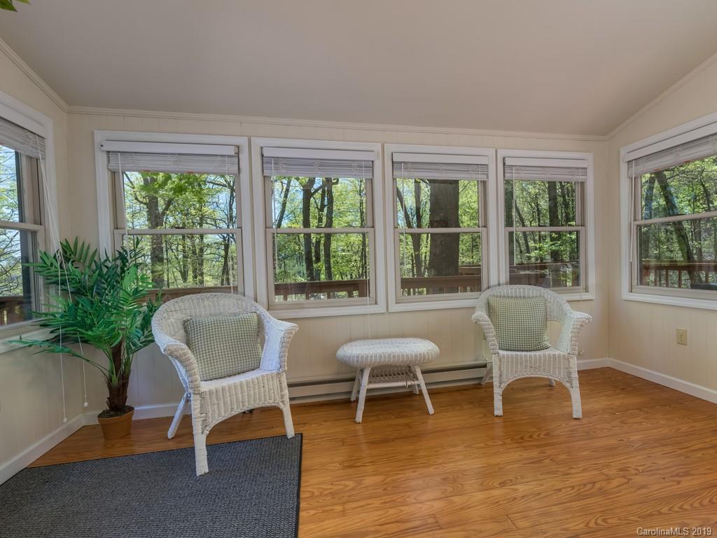 1251 Judes Gap Road Mill Spring, NC 28756 - Photo 10 of 35 a living room with furniture and windows