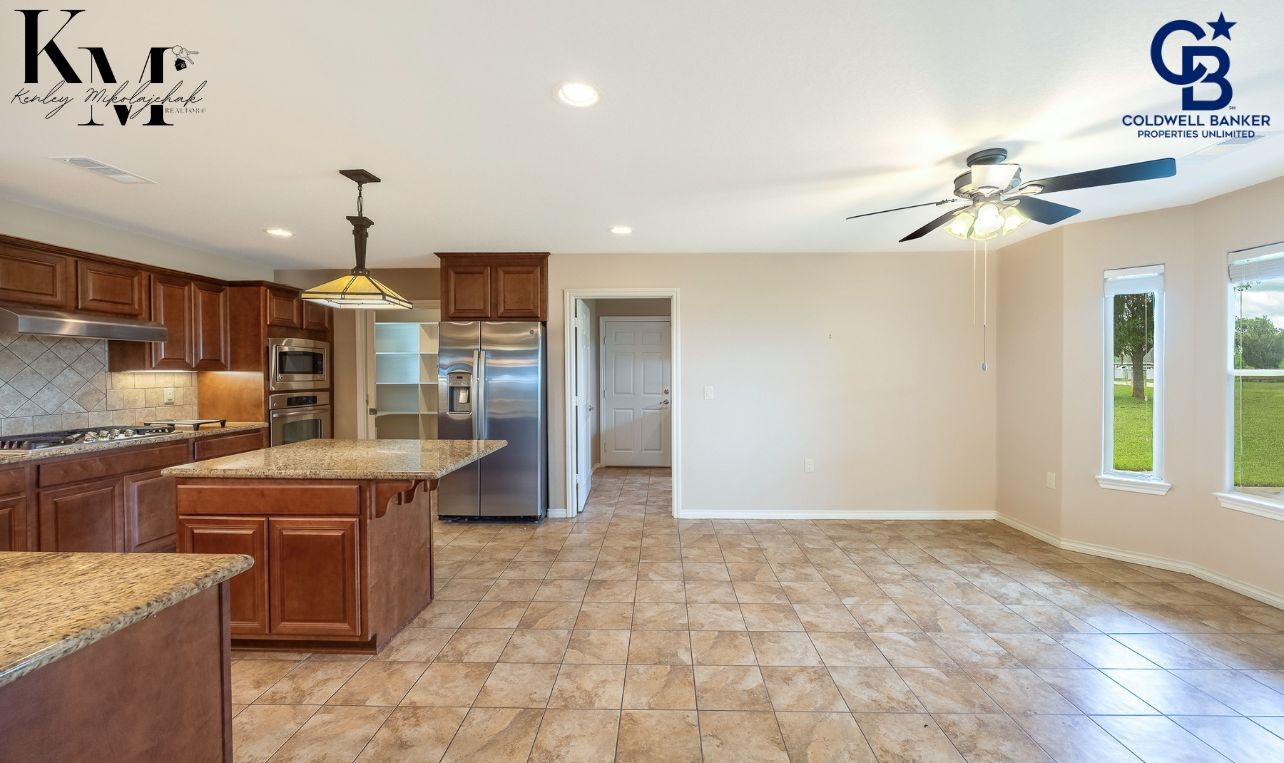 1980 Chappell Ridge Lane Brenham, TX 77833 - Photo 4 of 13 Light-filled dining space seamlessly connected to the main living areas for easy flow.