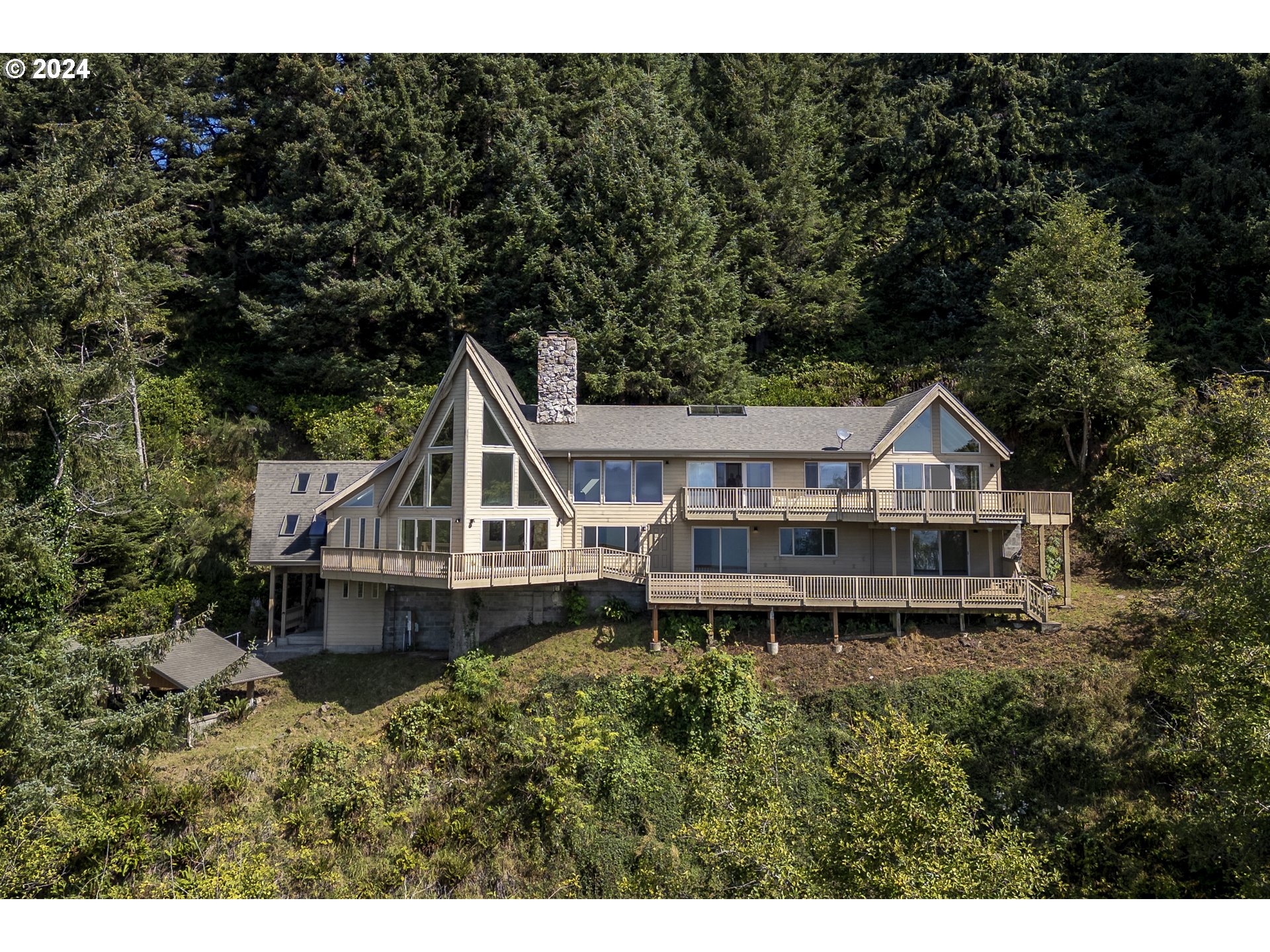 94515 Highway 101 Yachats, OR 97498 - Photo 1 of 45 a house with trees in the background
